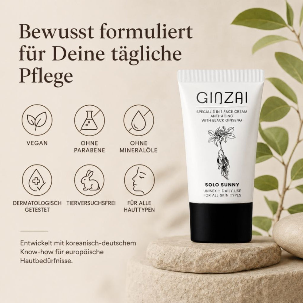GINZAI SOLO SUNNY Tube auf Steinsockel vor grünem Blatt, sechs Qualitäts-Icons: Vegan, Ohne Parabene, Ohne Mineralöle, Dermatologisch getestet, Tierversuchsfrei, Für alle Hauttypen